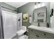 Bathroom with shower, modern vanity, lighting, and neutral tones at 1921 Hazelwood Se Dr, Marietta, GA 30067