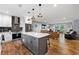 Open-concept kitchen boasts a center island, stainless appliances, and flows into a living space at 1921 Hazelwood Se Dr, Marietta, GA 30067