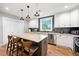 Stylish kitchen with white cabinets, granite countertops, stainless steel appliances, and a center island at 1921 Hazelwood Se Dr, Marietta, GA 30067