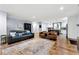 Stylish living room with hardwood floors, plenty of seating and an open view into the well-appointed kitchen at 1921 Hazelwood Se Dr, Marietta, GA 30067