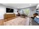 Comfortable living room with wood floors, a sitting area, a large window and a view of the neighborhood at 1921 Hazelwood Se Dr, Marietta, GA 30067