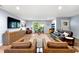 Cozy living room with wood floors, a large window, comfortable seating and a TV for relaxation at 1921 Hazelwood Se Dr, Marietta, GA 30067