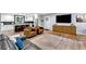 Open concept living room with modern furnishings, wood floors and a spacious layout that flows into the kitchen at 1921 Hazelwood Se Dr, Marietta, GA 30067