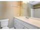 Bathroom featuring white marble countertop, vanity, and framed mirror at 1960 Mceachern Manor Sw Dr, Marietta, GA 30064