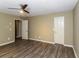 Bright bedroom with hardwood floors, ceiling fan, and neutral colored walls at 1960 Mceachern Manor Sw Dr, Marietta, GA 30064