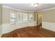 Dining room with bay windows, elegant wainscoting, and hardwood flooring at 1960 Mceachern Manor Sw Dr, Marietta, GA 30064