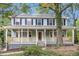 Charming two-story home with a welcoming front porch and beautiful landscaping at 1960 Mceachern Manor Sw Dr, Marietta, GA 30064