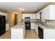 Bright and modern kitchen featuring granite countertops and white cabinets at 1960 Mceachern Manor Sw Dr, Marietta, GA 30064