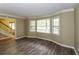Bright living room with large windows, hardwood floors, and elegant trim at 1960 Mceachern Manor Sw Dr, Marietta, GA 30064