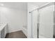 Bright bathroom featuring a soaking tub and separate glass-enclosed shower at 2946 Stockholm Way, Suwanee, GA 30024