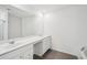 Modern bathroom with double sinks, a large mirror, and sleek white cabinets at 2946 Stockholm Way, Suwanee, GA 30024