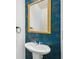Close-up of a half bathroom featuring a modern sink and gold floral wallpaper at 2946 Stockholm Way, Suwanee, GA 30024