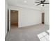 Spacious bedroom with plush gray carpeting and a modern ceiling fan fixture at 2946 Stockholm Way, Suwanee, GA 30024