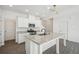 Modern kitchen featuring granite countertops, stainless steel appliances, and a large island at 2946 Stockholm Way, Suwanee, GA 30024