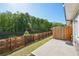 A lovely patio area with a wooden fence, providing privacy and a serene outdoor space with a view of the backyard at 2946 Stockholm Way, Suwanee, GA 30024