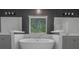 Luxurious soaking tub with neutral decor in the bathroom at 420 Tavistock Ct, Mcdonough, GA 30252