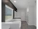 Bright bathroom featuring a soaking tub, marble accents, and a glass shower at 420 Tavistock Ct, Mcdonough, GA 30252