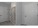 Neutral bathroom featuring a glass shower, marble accents, and tiled floors at 420 Tavistock Ct, Mcdonough, GA 30252
