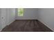 Neutral carpeted bedroom showcasing a window with natural light at 420 Tavistock Ct, Mcdonough, GA 30252