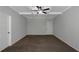 Empty bedroom with beamed ceilings, neutral walls and carpet, and two doors at 420 Tavistock Ct, Mcdonough, GA 30252