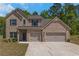 Charming brick two-story home with a two-car garage, landscaped yard, and welcoming front entrance at 420 Tavistock Ct, Mcdonough, GA 30252