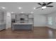 Open-concept kitchen featuring an island, recessed lighting, and modern stainless steel appliances at 420 Tavistock Ct, Mcdonough, GA 30252