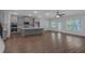 Spacious kitchen with an island, modern appliances, wood floors, and grey cabinets at 420 Tavistock Ct, Mcdonough, GA 30252