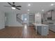 Open floor plan with hardwood floors and access to the kitchen, foyer, and staircase at 420 Tavistock Ct, Mcdonough, GA 30252