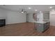 Large living area with hardwood floors, fireplace, and an island kitchen at 420 Tavistock Ct, Mcdonough, GA 30252