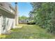 Backyard featuring a patio, lawn, and some trees at 3656 Oak Sw Ln, Powder Springs, GA 30127