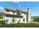 Back of home with a patio and fenced backyard on a sunny day at 3656 Oak Sw Ln, Powder Springs, GA 30127