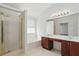 The main bath has a large garden tub, a separate glass enclosed shower, and a dual sink vanity at 3656 Oak Sw Ln, Powder Springs, GA 30127