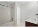 Bathroom featuring a shower-tub combination, vanity with sink, and a neutral color palette at 3656 Oak Sw Ln, Powder Springs, GA 30127