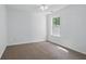 Bedroom featuring fresh paint, new carpet and a large window at 3656 Oak Sw Ln, Powder Springs, GA 30127
