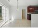 Bright dining area with a sliding glass door and partial view of the kitchen at 3656 Oak Sw Ln, Powder Springs, GA 30127