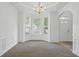 Elegant dining room with a decorative chandelier and natural light at 3656 Oak Sw Ln, Powder Springs, GA 30127