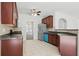 Well-equipped kitchen featuring stainless steel appliances and tiled floor at 3656 Oak Sw Ln, Powder Springs, GA 30127