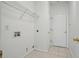 Laundry room with tile floors and open wire shelving at 3656 Oak Sw Ln, Powder Springs, GA 30127