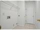 This clean laundry room features a white door and tiled floor, ready for your appliances at 3656 Oak Sw Ln, Powder Springs, GA 30127