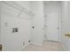 The laundry room has tile flooring, and shelving storage above for convenience at 3656 Oak Sw Ln, Powder Springs, GA 30127