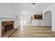 Bright and open living room with a fireplace and seamless access to the kitchen at 3656 Oak Sw Ln, Powder Springs, GA 30127