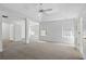 The spacious main bedroom offers plush carpeting, ceiling fan, and neutral paint colors at 3656 Oak Sw Ln, Powder Springs, GA 30127