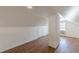 Finished attic with hardwood floors, skylight, and painted brick column at 1560 Temple Ave, College Park, GA 30337
