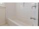 Bright bathroom featuring white subway tile surround and chrome fixtures at 1560 Temple Ave, College Park, GA 30337