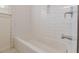 Clean white subway tile surrounds the bathtub area at 1560 Temple Ave, College Park, GA 30337