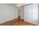Large bedroom boasting hardwood floors, ceiling fan, and ample closet space at 1560 Temple Ave, College Park, GA 30337