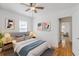 Comfortable bedroom with modern decor, hardwood floors, and soft natural light at 1560 Temple Ave, College Park, GA 30337