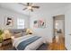 Cozy bedroom with soft lighting, hardwood floors, and coordinated decor at 1560 Temple Ave, College Park, GA 30337