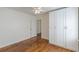 Bedroom with hardwood floors, ceiling fan and large closet at 1560 Temple Ave, College Park, GA 30337