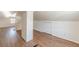 Bright bonus room featuring wood floors, a painted brick column, and dormer windows at 1560 Temple Ave, College Park, GA 30337